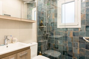 Shower, hair dryer, towels, soap
