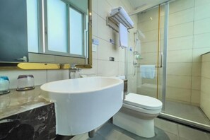 A modern bathroom with a large white sink, a toilet, and a glass shower enclosure. - Jiangmen Jinxi International Hotel (Wuyi University Lihe Plaza) (Jiangmen)
