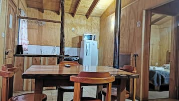 Family Cabin | Private kitchen | Microwave, electric kettle, cookware/dishes/utensils, dining tables