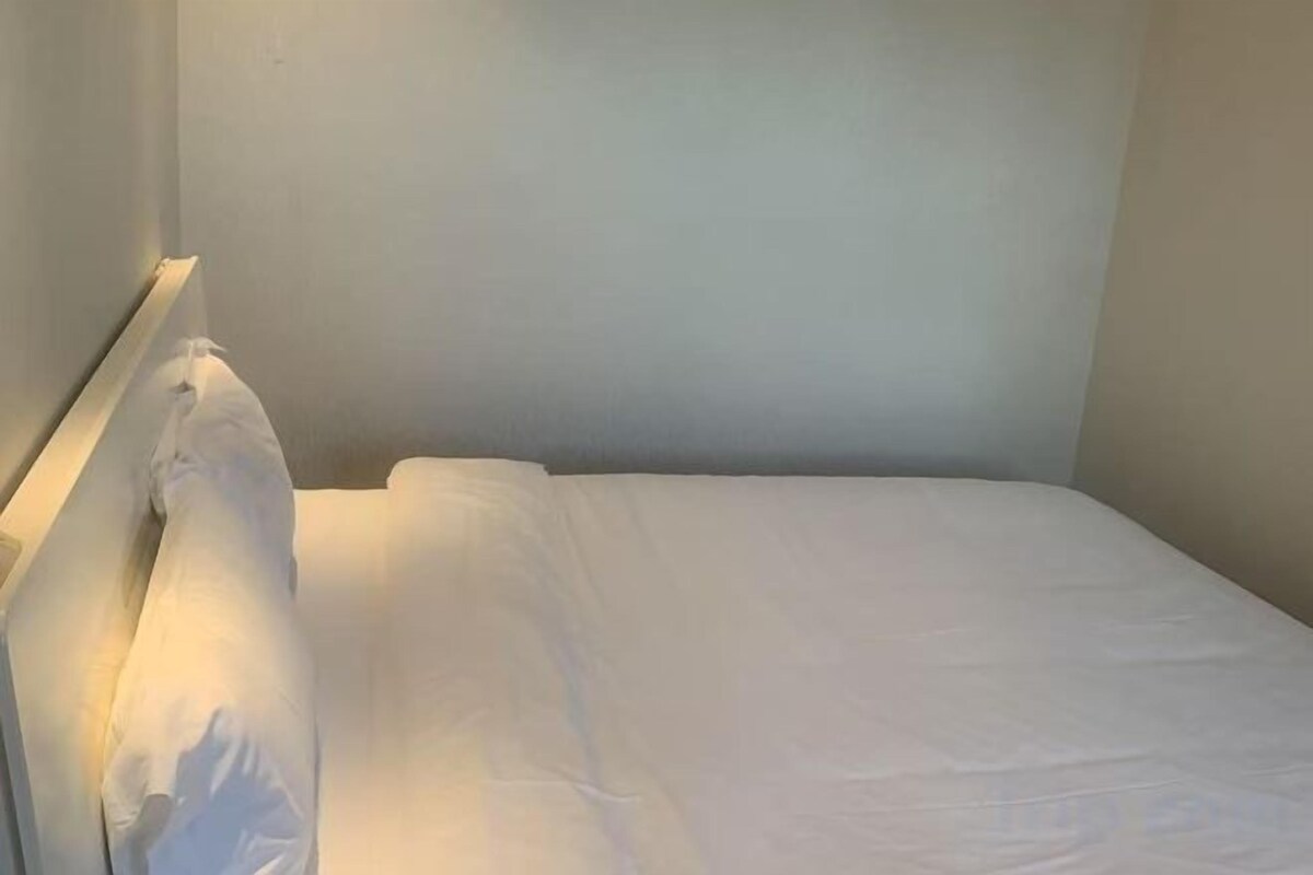 Down comforters, desk, blackout drapes, iron/ironing board