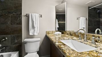 Shower, eco-friendly toiletries, hair dryer, towels