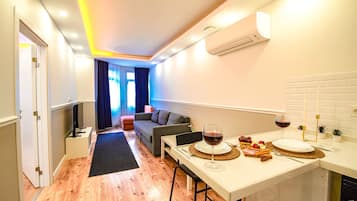 Deluxe Condo | Living area | 104-cm Smart TV with digital channels, TV