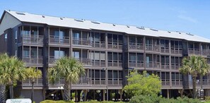 A multi-story hotel with balconies, a flat roof, and a sign indicating it is the "Tilleman Hotel." - Amazing Ocean and Pool Views!  Unit 211 - BEAUTIFUL POOL DECK REMODEL COMPLETE! (North Myrtle Beach)