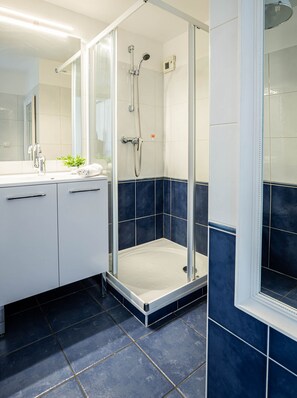 Shower, hair dryer, towels, soap