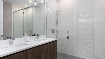 Shower, hair dryer, towels, shampoo