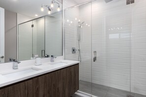 Shower, hair dryer, towels, shampoo