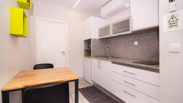 Fridge, microwave, stovetop, coffee/tea maker