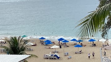 On the beach, sun loungers, beach towels