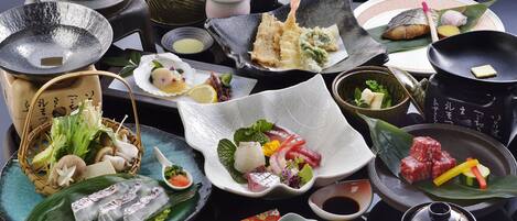 A variety of Japanese dishes and utensils on a table.