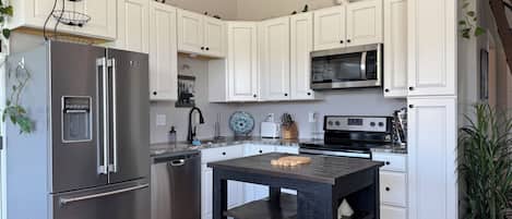 Coffee/tea maker, fridge, microwave, oven