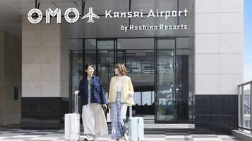 A building with a sign reading "Kansai Airport by Hashino Resorts".