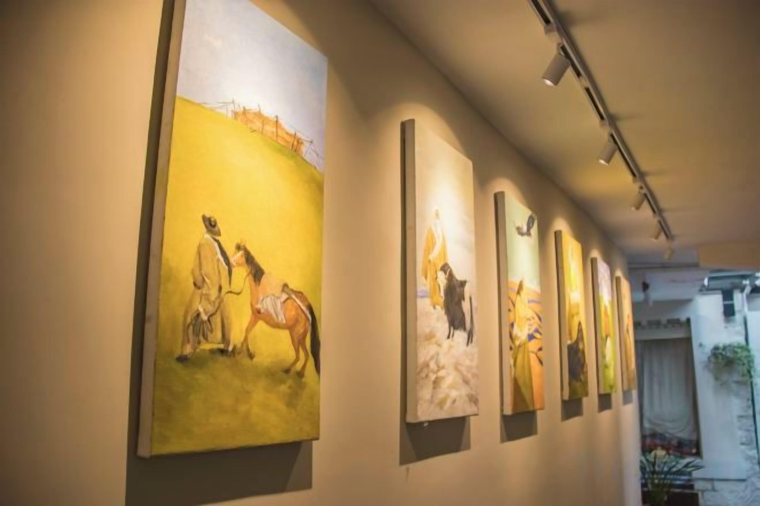 A gallery with artworks on display.