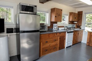 Enjoy cooking in this well-equipped kitchen with a refrigerator, microwave, double oven, and coffee maker.