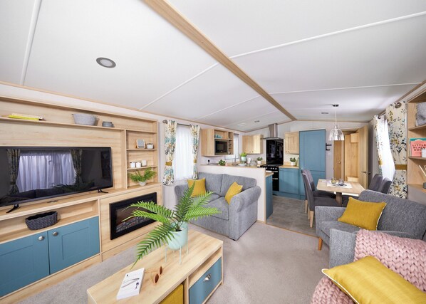 Living area - Stylish with a touch of luxury 12ft-wide caravan with one double and two twins. (Penhallow)