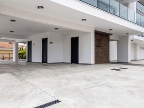 A modern building with a spacious lobby, multiple doors, and a sign indicating 'SANDERS ELGIO MARY RESIDENCE'. - Sanders Elgio Limassol - Full Building (Limassol)