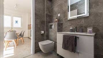 Shower, hair dryer, towels, soap