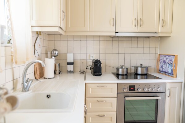 A kitchen with a sink, stove, oven, and cabinets. - Kos Secret Villa with private pool (Kos)