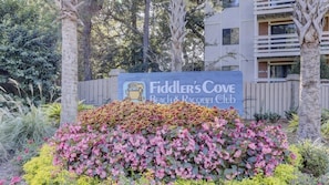 Enjoy a natural atmosphere surrounded by landscaped plants and trees at Fiddler's Cove Beach & Racquet Club.