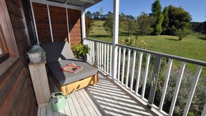 Relax on the deck with a comfortable bench and enjoy the serene surroundings.