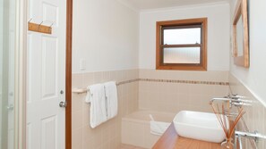 Bathtub, hair dryer, towels