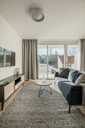 Premium Apartment, Balcony | Living area | 24-inch flat-screen TV with cable channels, TV - URBM[rise] (Vienna)
