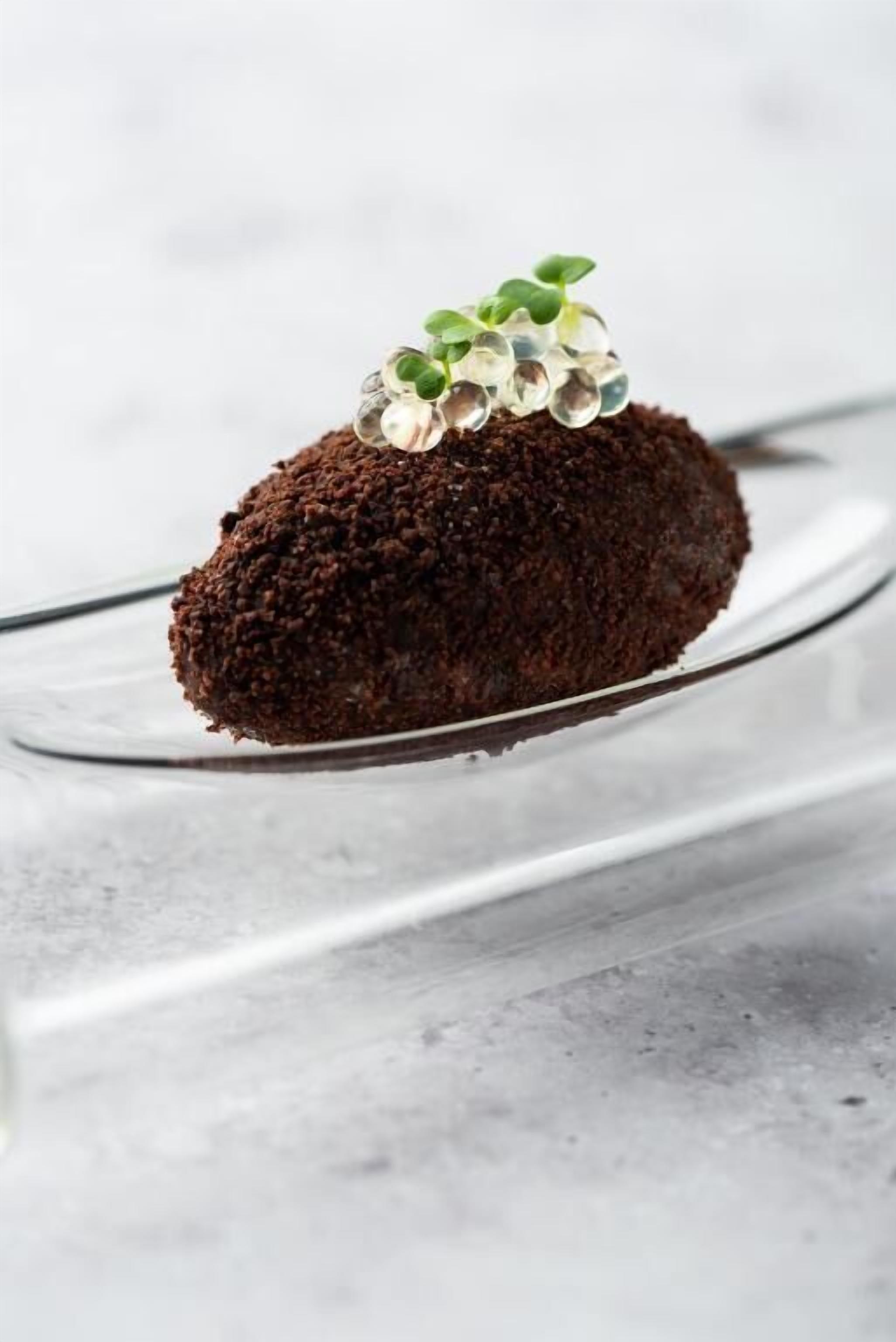 A dessert on a clear glass plate.