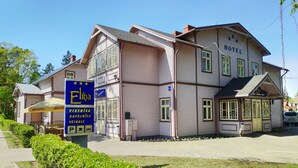 A two-story hotel with a signboard for 'Elina' and a visible entrance. - Hotel Elīna (Jurmala)