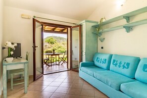 TV, fireplace -  Museddu Beach First floor in residence with swimming pool (Cardedu)