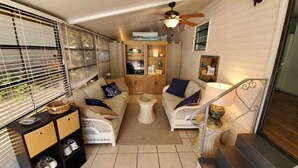A cozy living area with a sofa set, a coffee table, and a TV cabinet. - Newly updated in family/pet friendly resort with all the amenities - near beach! (Nokomis)