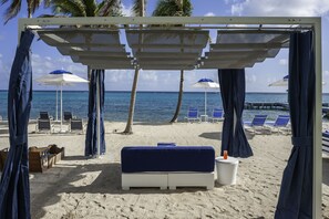 On the beach, sun-loungers, beach umbrellas, beach towels - Club Suites at Rum Point (North Side)