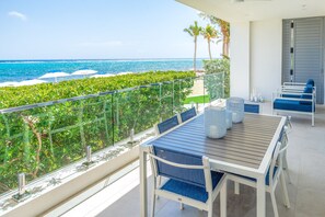 1BR w Den Oceanfront Suite | Terrace/patio - Club Suites at Rum Point (North Side)