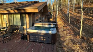 A wooden deck with a hot tub and a bench. - Close to town cabin w/Hot Tub in Steamboat Springs (Steamboat Springs)