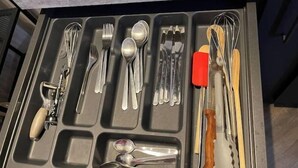 A drawer organizer with compartments holding various kitchen utensils. - 🌹🍾Superb studio 5 mins from cathedral 🥂 (Reims)