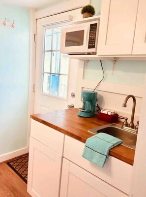 Fridge, microwave, coffee/tea maker, toaster