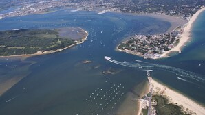 An aerial view of a coastal area with a marina, beach, and urban development. - The Old Townhouse - Room 4 (Poole)