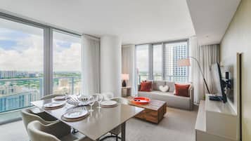 Luxury Apartment | Living area | 48-inch Smart TV with cable channels, TV, streaming services