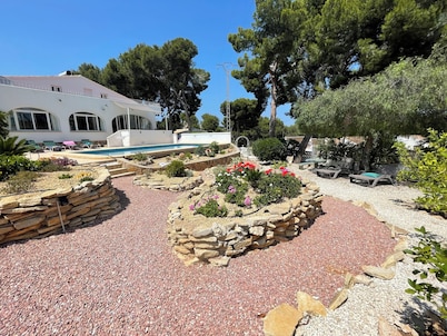 Lovely Spanish villa near to town and beach set in flowered gardens