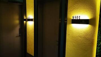 A hallway with doors, each marked with a number.