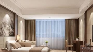A hotel room with two beds, a desk, a chair, a TV, and a large window with curtains.