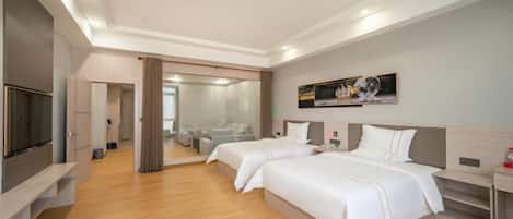 A hotel room with two beds, a TV, a mirror, and a painting on the wall.