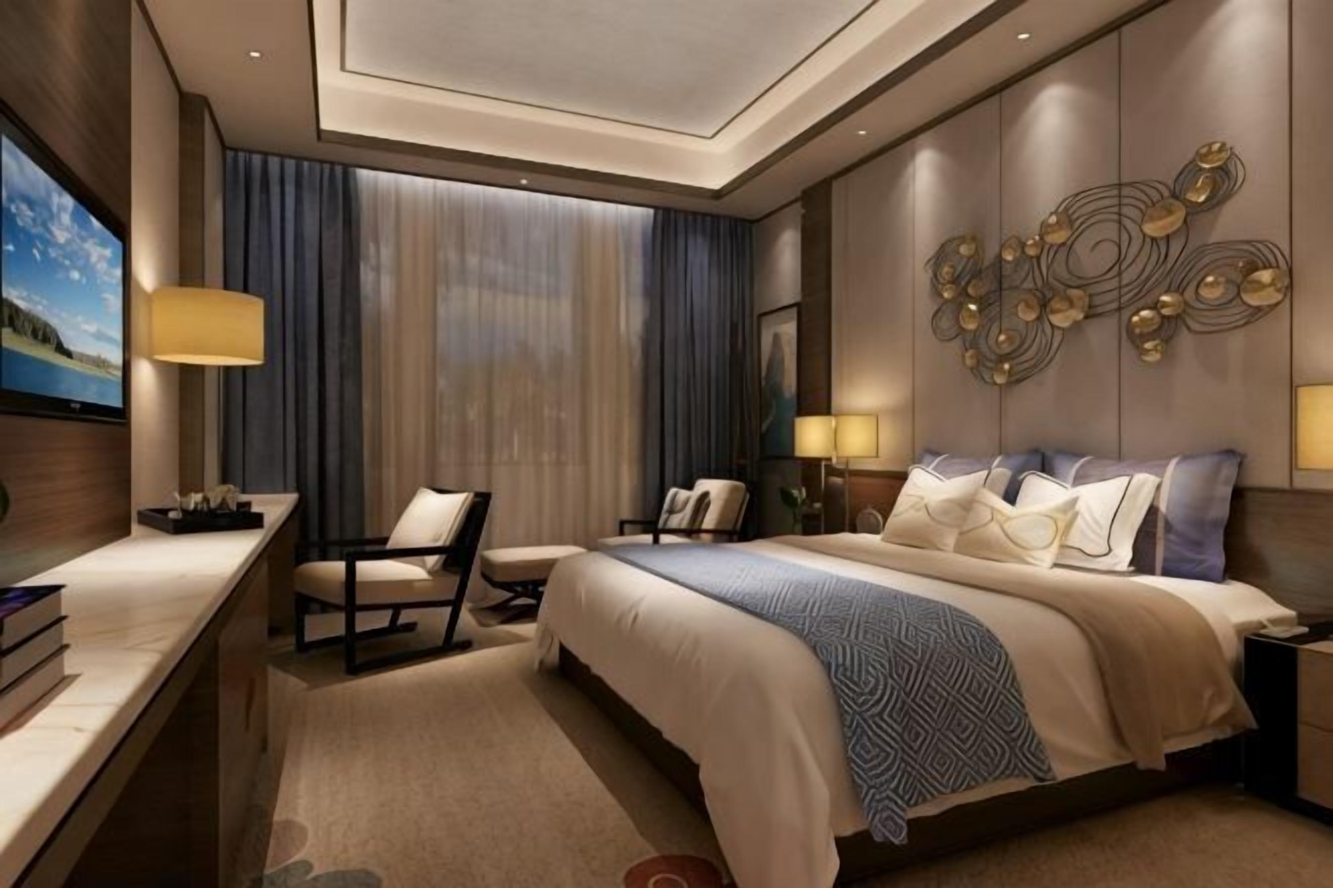 Una habitación de hotel con una cama grande, un escritorio, una silla y un televisor.