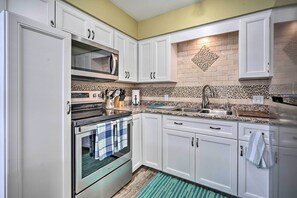 Fridge, microwave, stovetop, coffee/tea maker