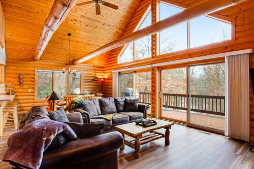 Secluded, dog-friendly home with tree-lined view, firepit, fireplace, & deck