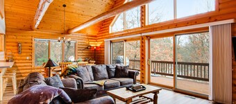 Secluded, dog-friendly home with tree-lined view, firepit, fireplace, & deck