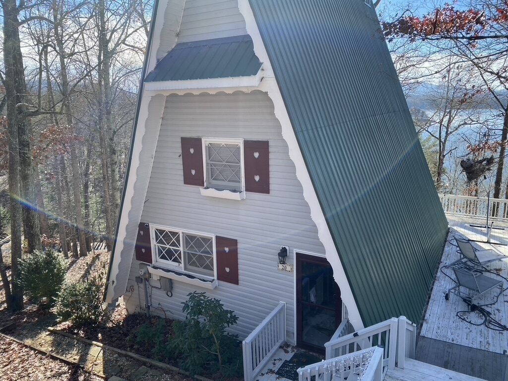 Updated A-frame house. With long lake views.
