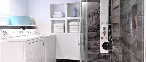 Shower, hair dryer, towels, soap