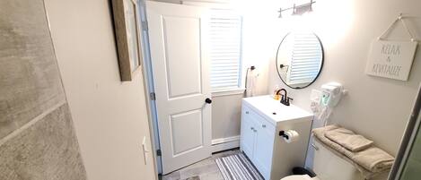 Shower, hair dryer, towels, soap