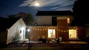 A house with a patio area, string lights, and a view of the moon. - Magnolia Inn - Columbia's Sweet Southern Charmer! (Columbia)