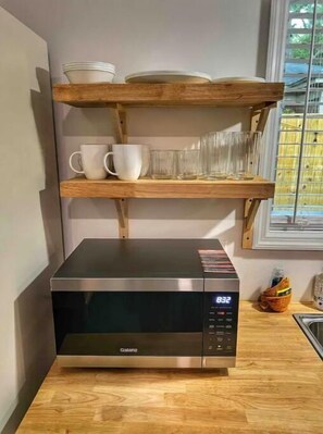 Fridge, microwave, stovetop, coffee/tea maker