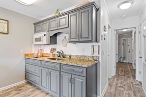 Fridge, microwave, stovetop, coffee/tea maker